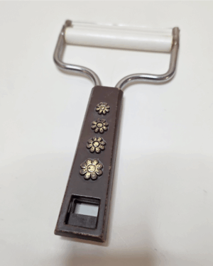 Travco Flower Power Brown & Gold Cheese Slicer